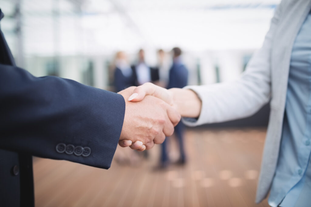 close up of businesspeople shaking hands close up of businesspeople shaking hands